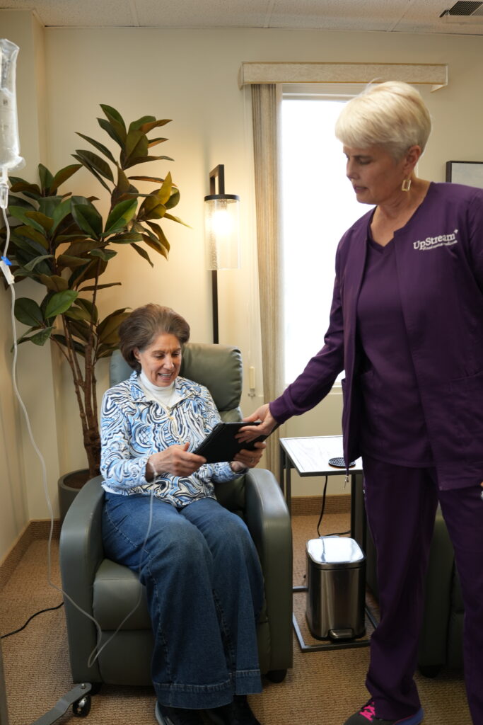 Functional medicine gut health care in Omaha, with an UpStream clinician reviewing information with a patient during a personalized treatment visit.