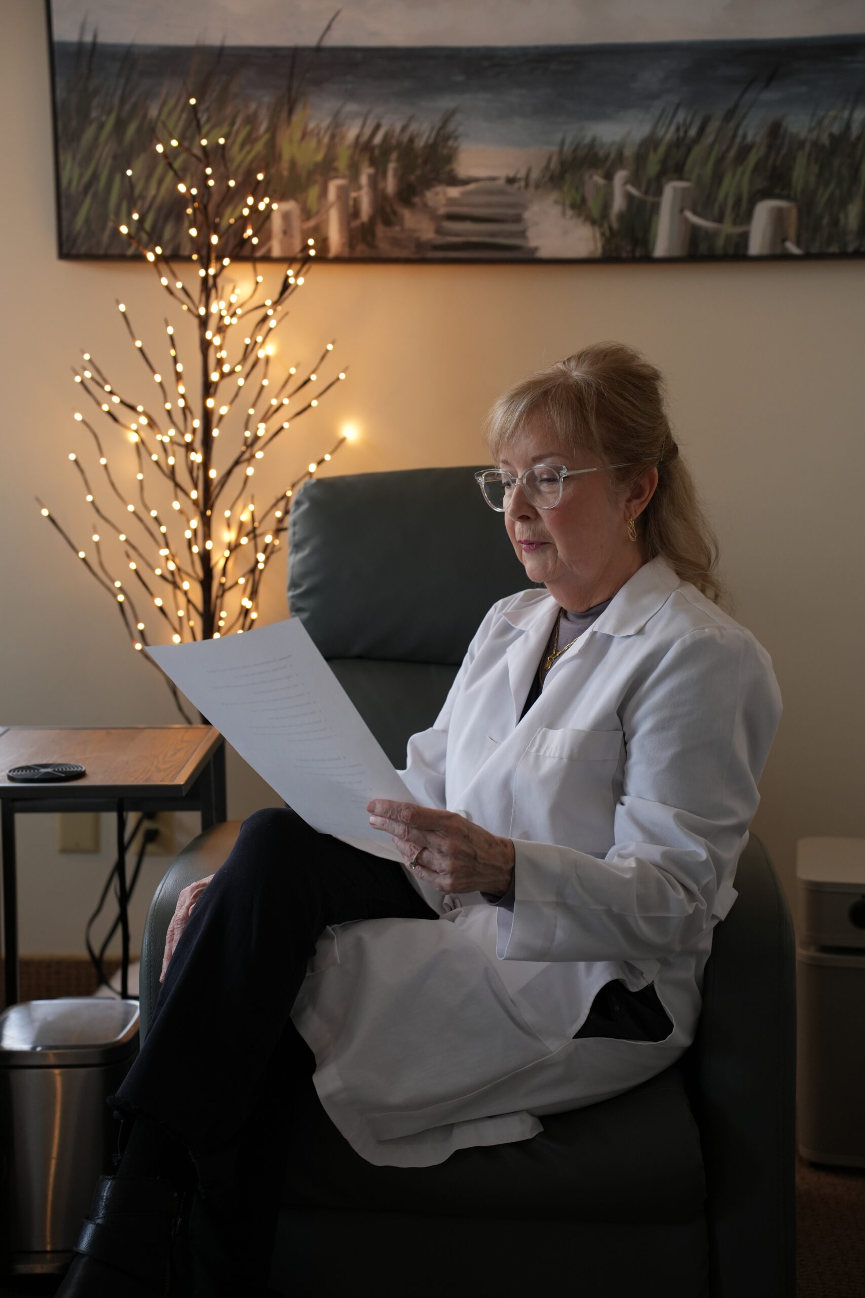 Provider reviewing patient records during a consultation for Omaha root cause fatigue, illustrating a systems-based functional medicine approach to understanding chronic fatigue.