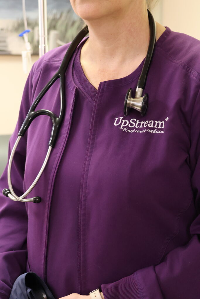 Functional medicine provider at UpStream Root Cause Medicine in Omaha, illustrating a systems-based approach to root cause fatigue in Omaha.