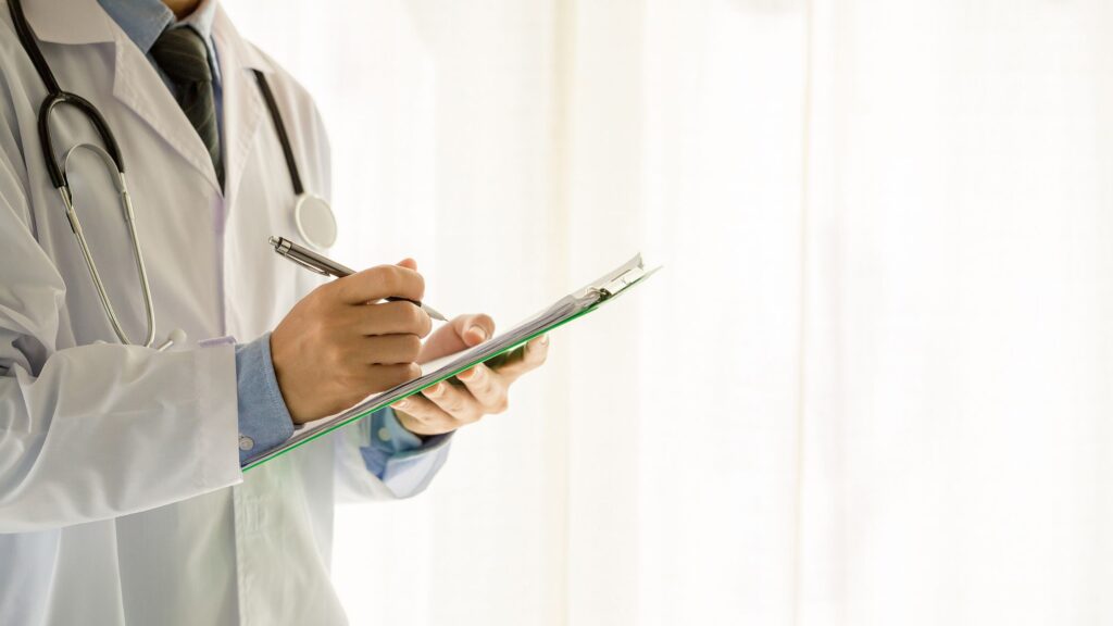 Clinician reviewing patient information during a functional medicine stress Omaha evaluation.