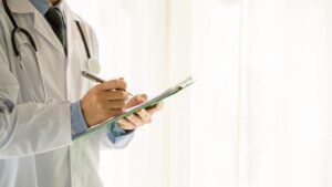 Clinician reviewing patient information during a functional medicine stress Omaha evaluation.