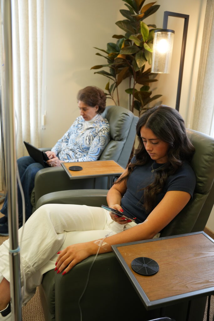 Integrative medicine Omaha NE care environment showing patients receiving IV therapy in a calm, clinically supervised setting focused on comfort and coordinated care.