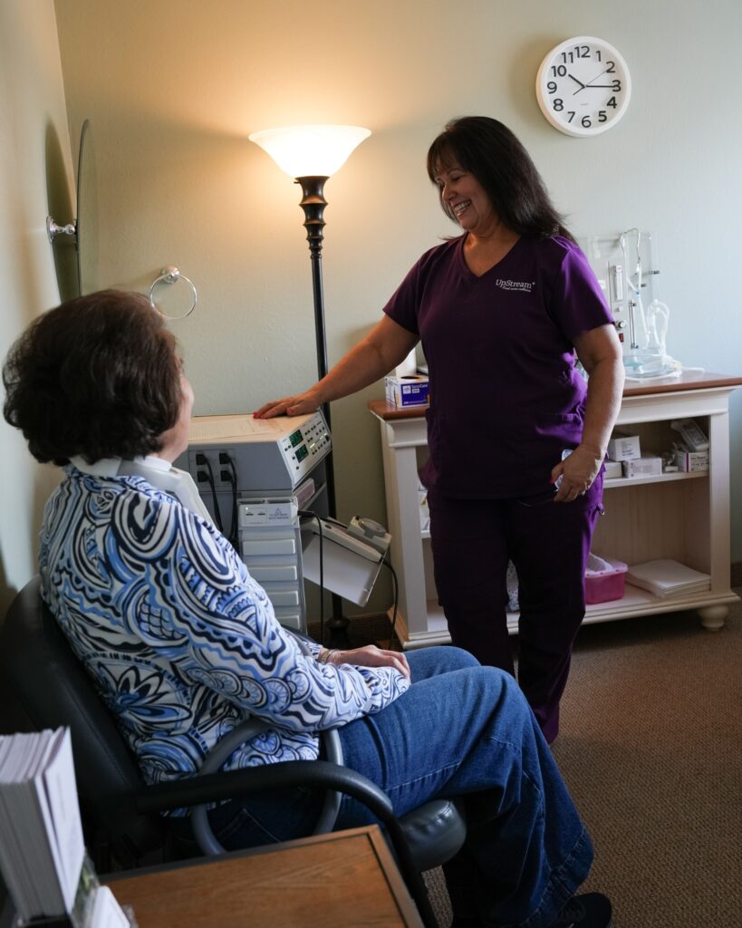 Functional medicine practitioner consulting with patient during treatment for afternoon fatigue and energy crashes